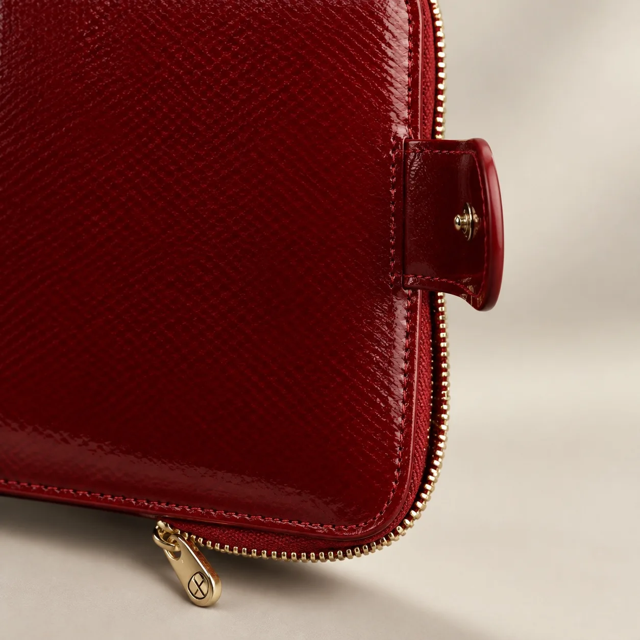 Gold-tone zip and corner detail